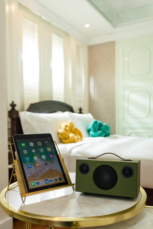 Voodi või voodid majutusasutuse Tung Nam Lou Art Hotel toas