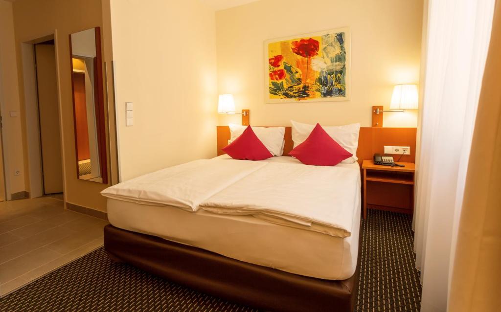 Ένα ή περισσότερα κρεβάτια σε δωμάτιο στο Central Hotel Löwen