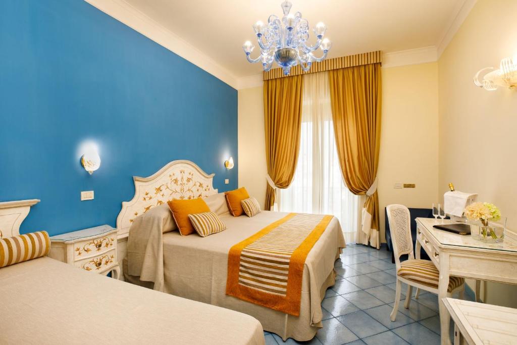 Postel nebo postele na pokoji v ubytování Hotel Zi' Teresa