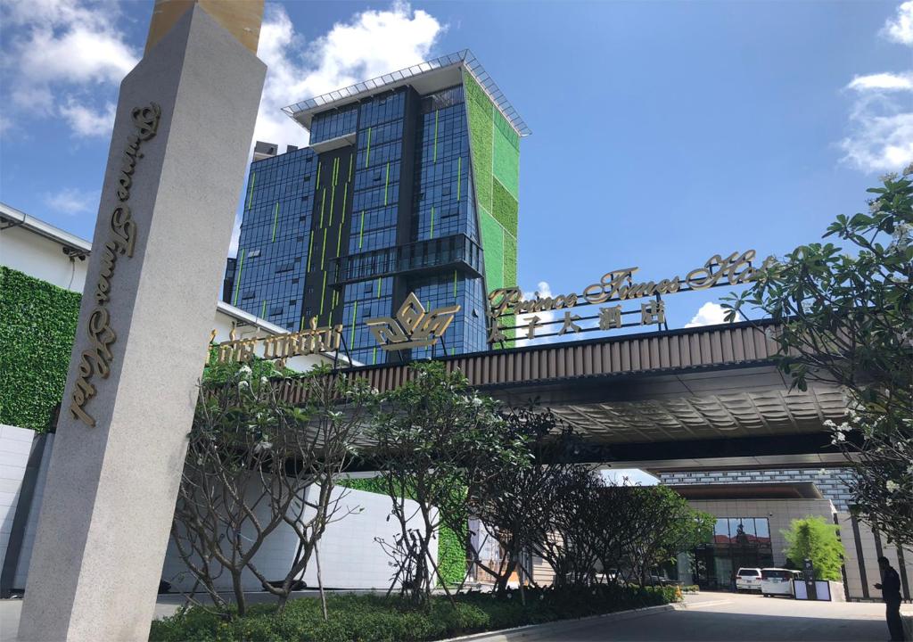 a bridge over a street with a building in the background at Prince Times Hotel in Sihanoukville