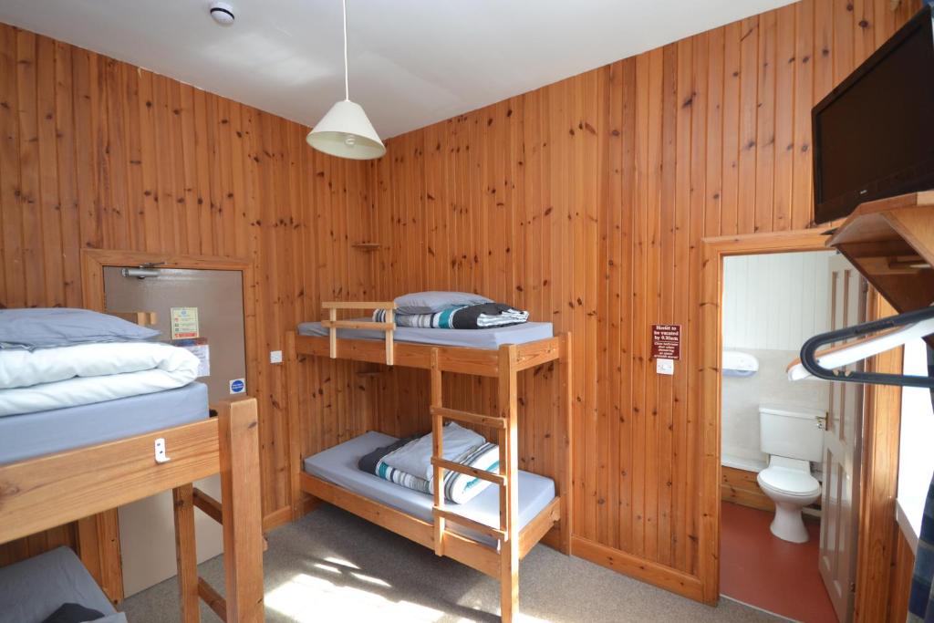 Postel nebo postele na pokoji v ubytování Blackwater Hostel