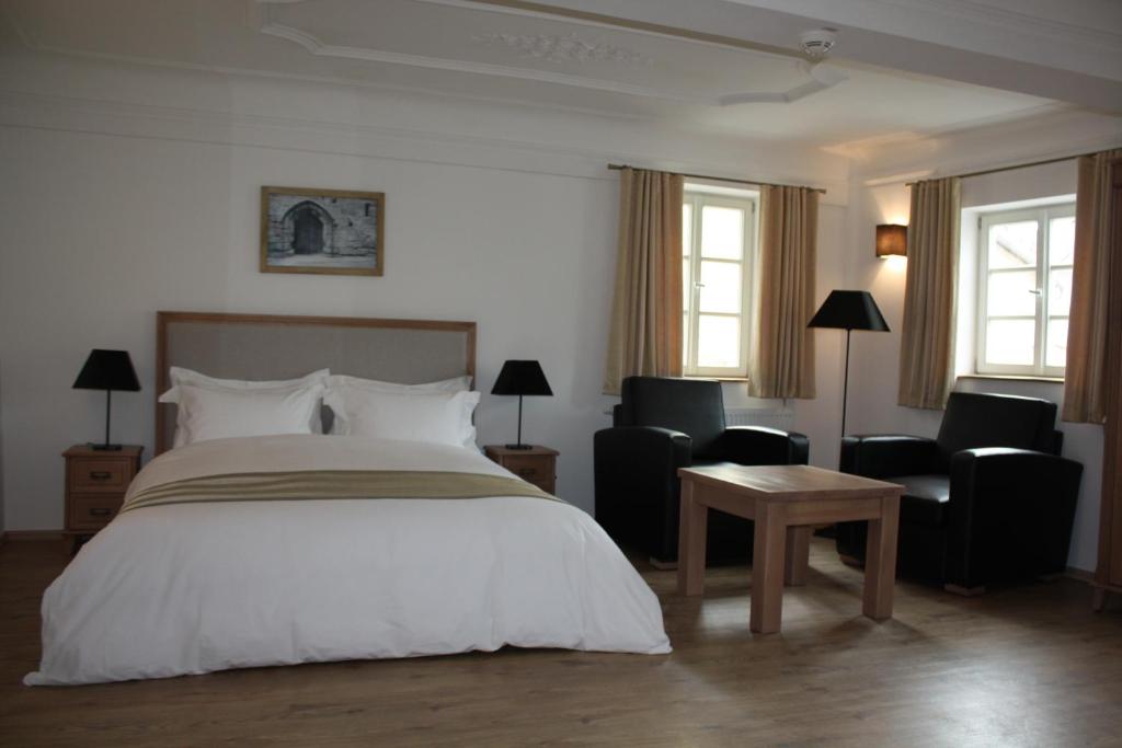 Postel nebo postele na pokoji v ubytování Hotel Hahnmühle 1323
