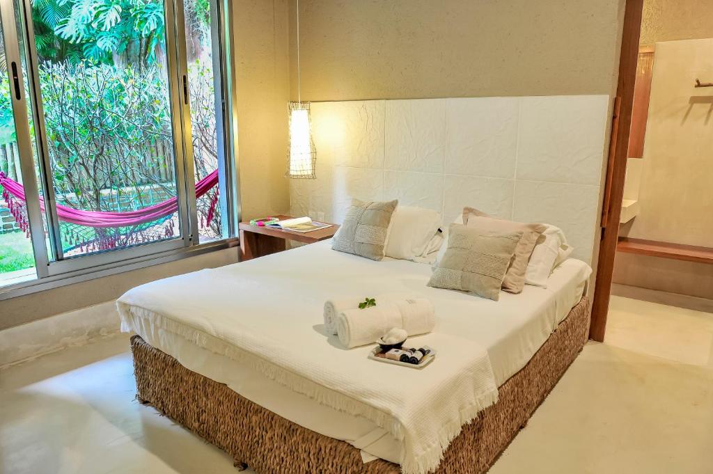 Postel nebo postele na pokoji v ubytování Mercatto Casa Hotel Boutique