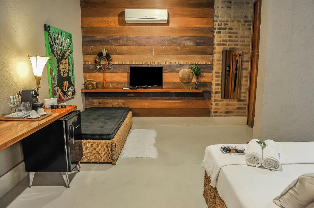 TV a/nebo společenská místnost v ubytování Mercatto Casa Hotel Boutique