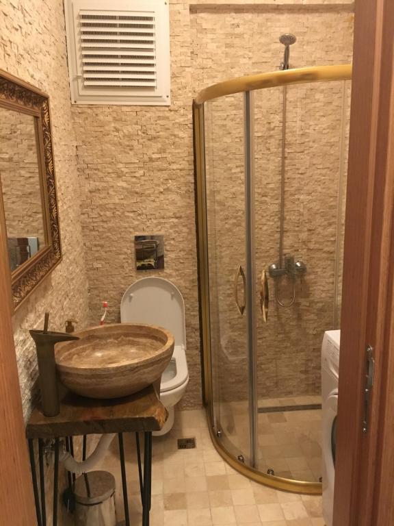 a bathroom with a sink and a shower at Old town kagitci apart in Istanbul