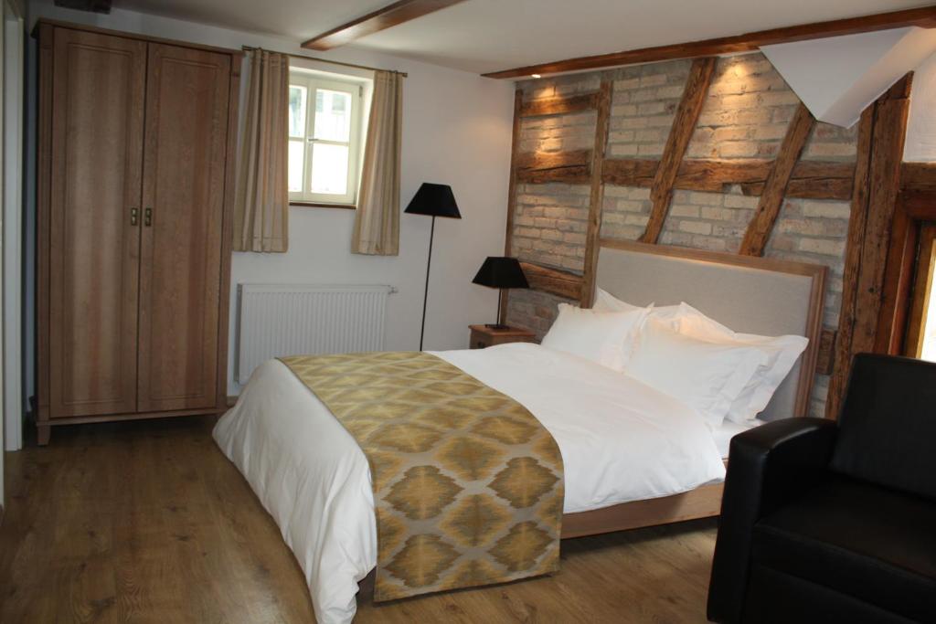Postel nebo postele na pokoji v ubytování Hotel Hahnmühle 1323