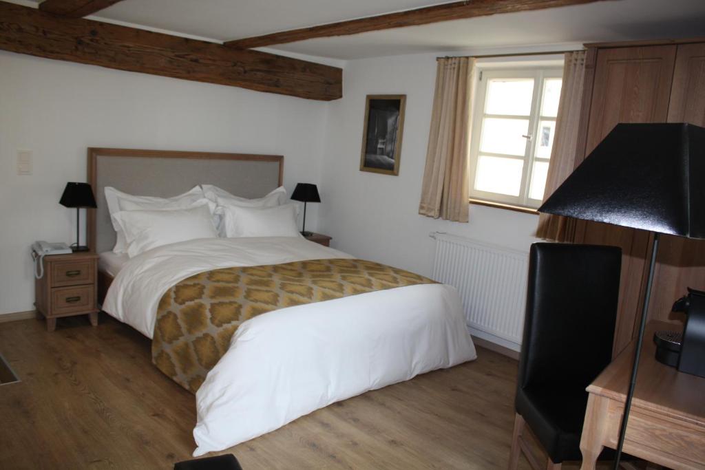 Postel nebo postele na pokoji v ubytování Hotel Hahnmühle 1323