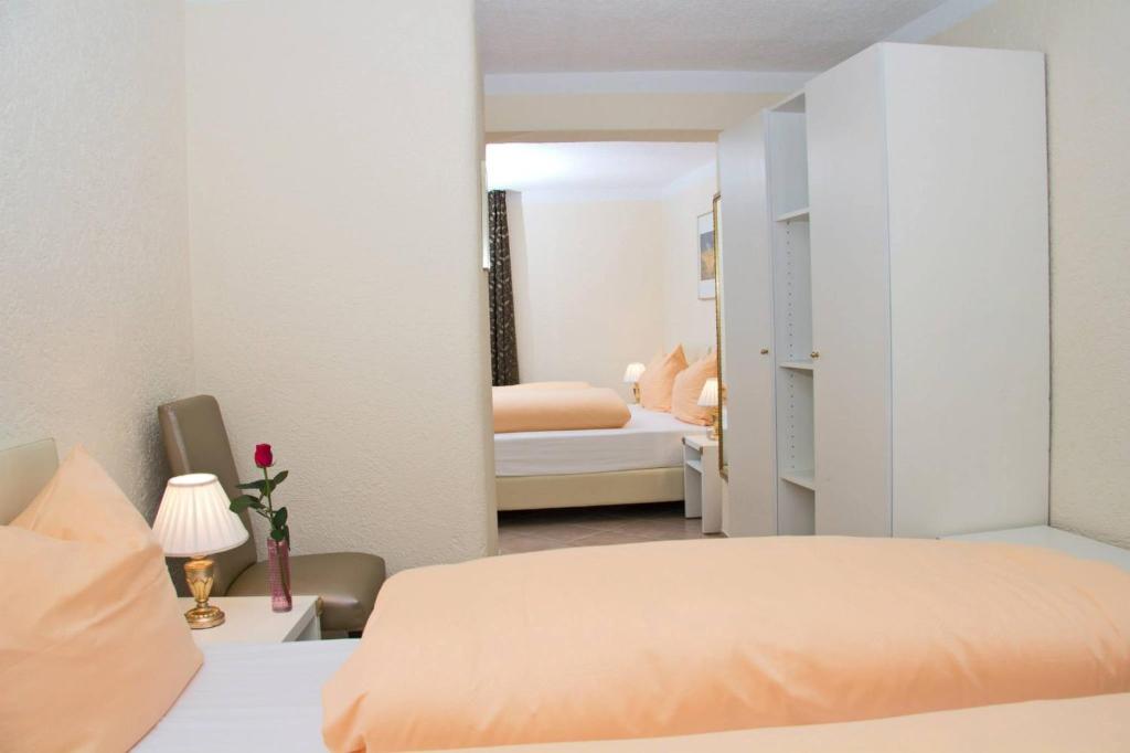 Postel nebo postele na pokoji v ubytování Hotel Albergo Mamma Rosa