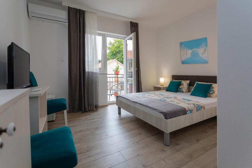 Postel nebo postele na pokoji v ubytování Villa Odobasic Rooms