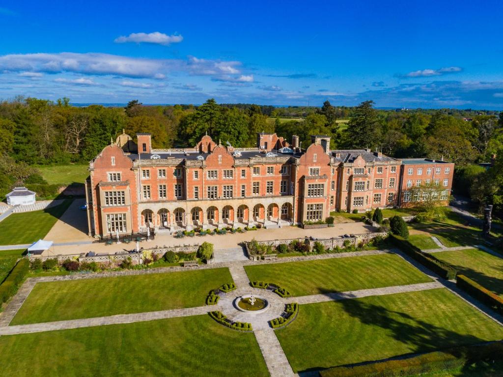 an aerial view of a large mansion with a garden at Easthampstead Park in Bracknell
