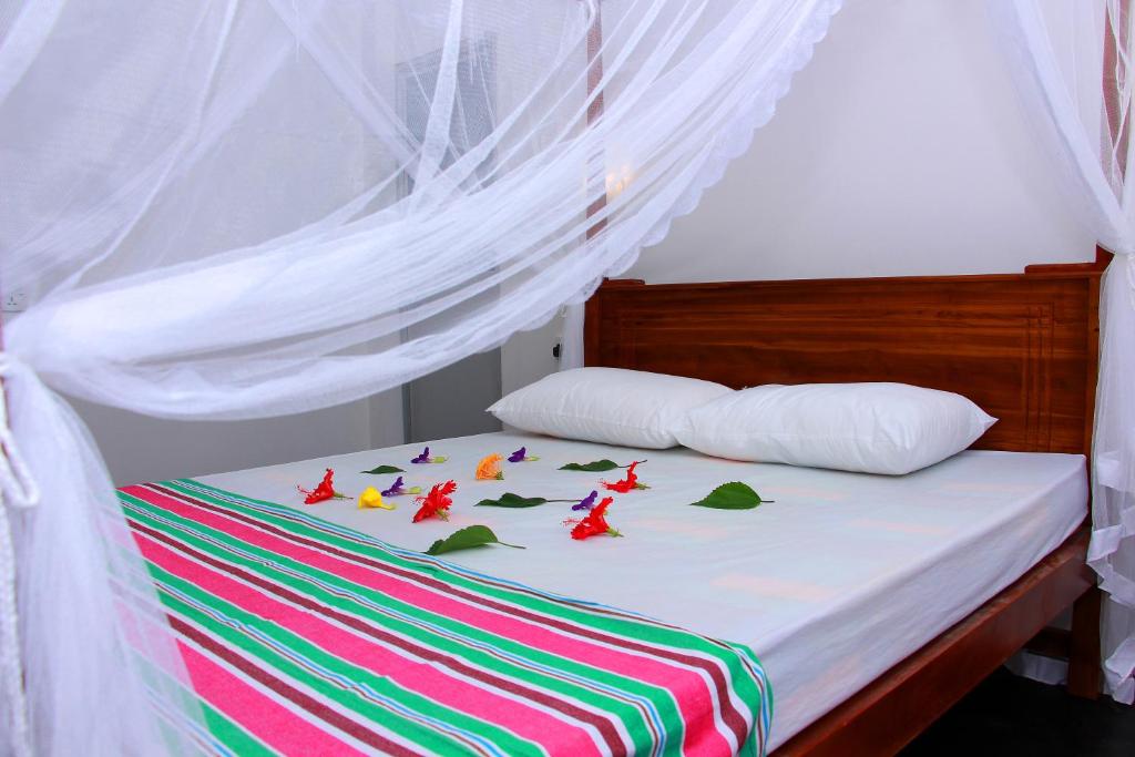 Postel nebo postele na pokoji v ubytování Sasaa Guest House