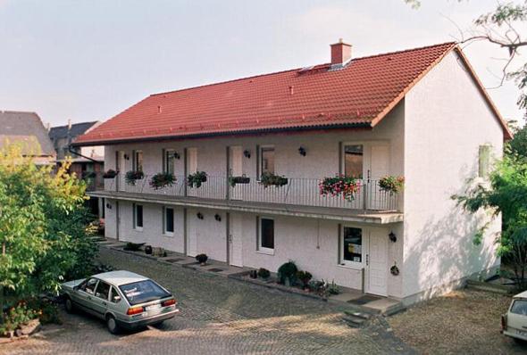 a house with a car parked in front of it at Landhotel Lützen-Stadt in Lützen