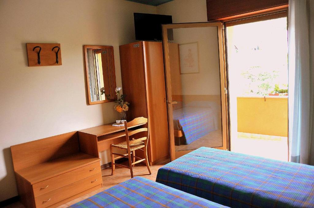 Postel nebo postele na pokoji v ubytování Locanda da Cidalie
