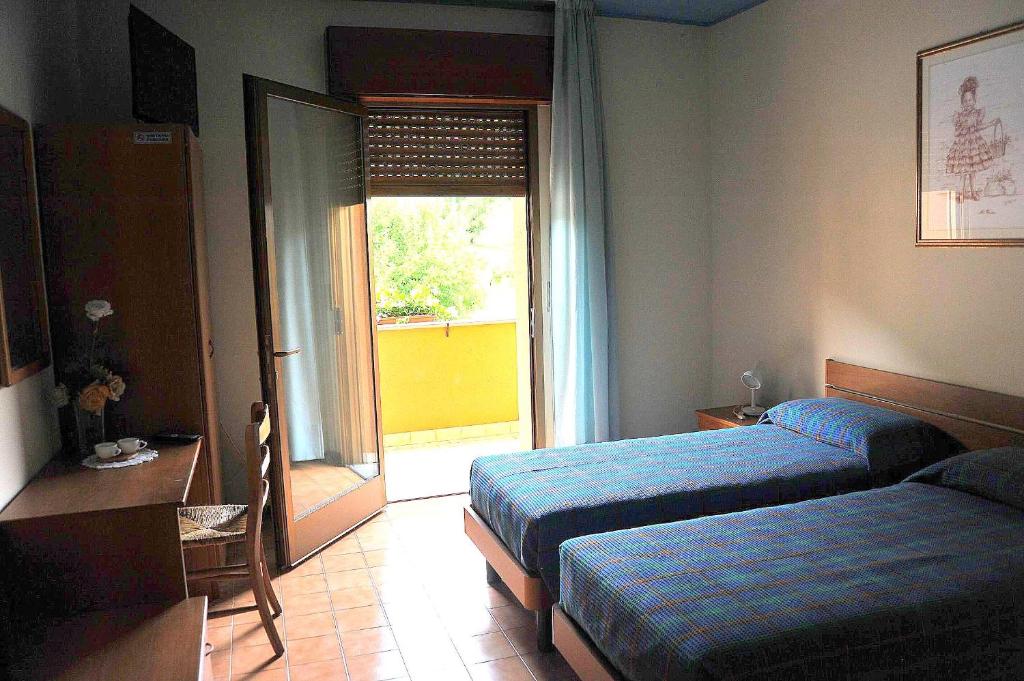 Postel nebo postele na pokoji v ubytování Locanda da Cidalie