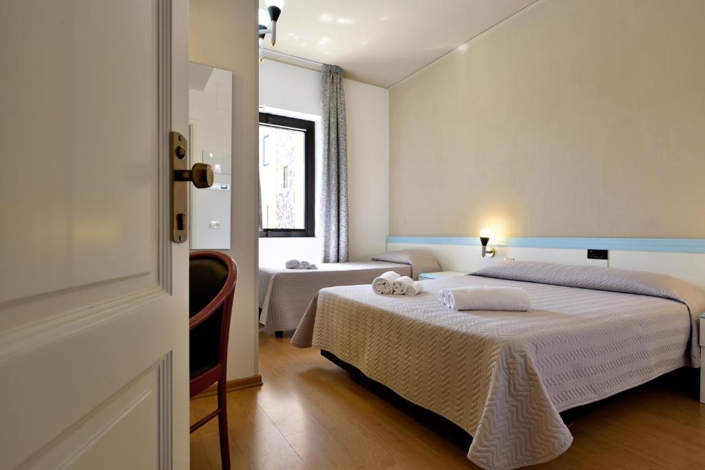 Postel nebo postele na pokoji v ubytování Hotel Orri