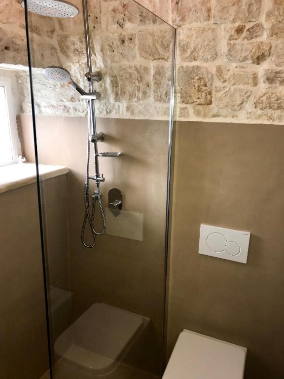 A bathroom at Trulli Storie di Puglia - Private Pool