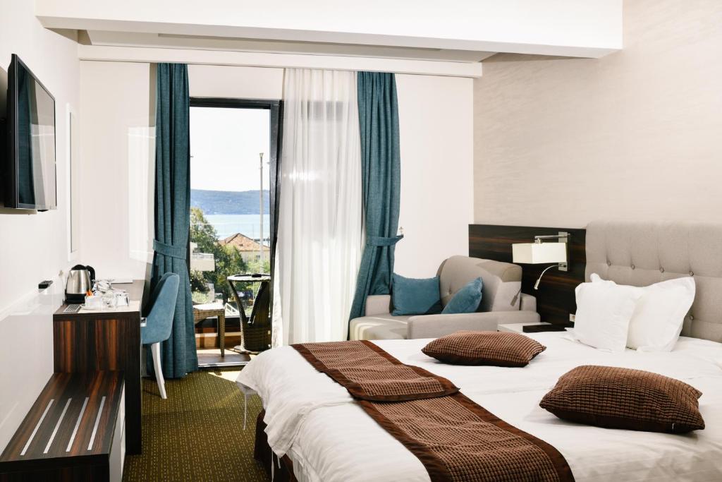 Postel nebo postele na pokoji v ubytování Wellness & Spa Hotel ACD