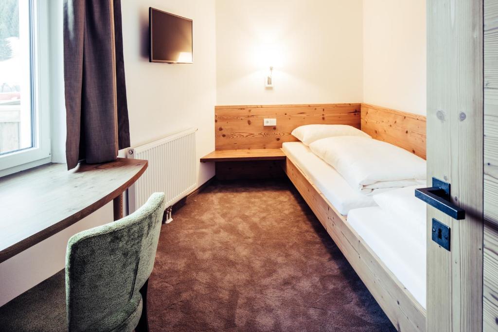 Postel nebo postele na pokoji v ubytování Biohotel Bergzeit
