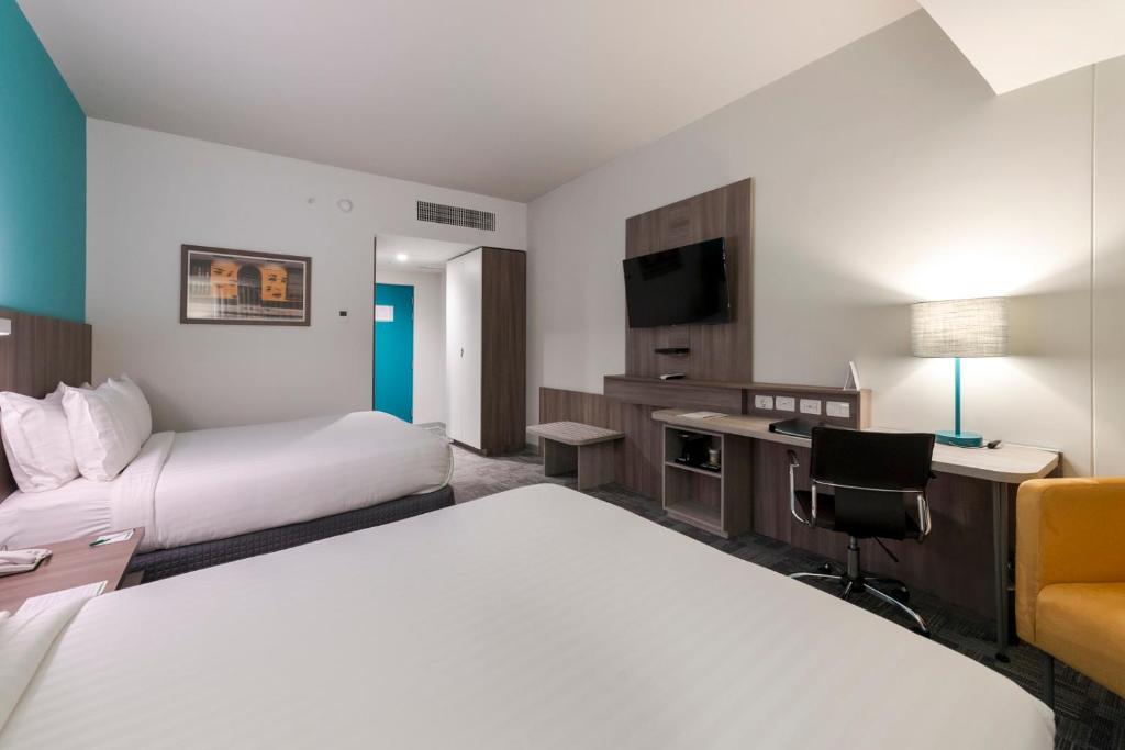 Postel nebo postele na pokoji v ubytování Holiday Inn - Lima Airport by IHG