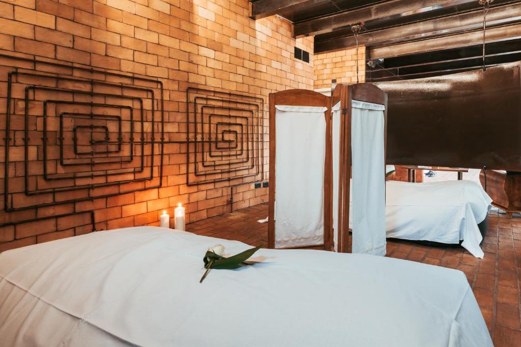 Postel nebo postele na pokoji v ubytování Foro Appio Mansio Hotel