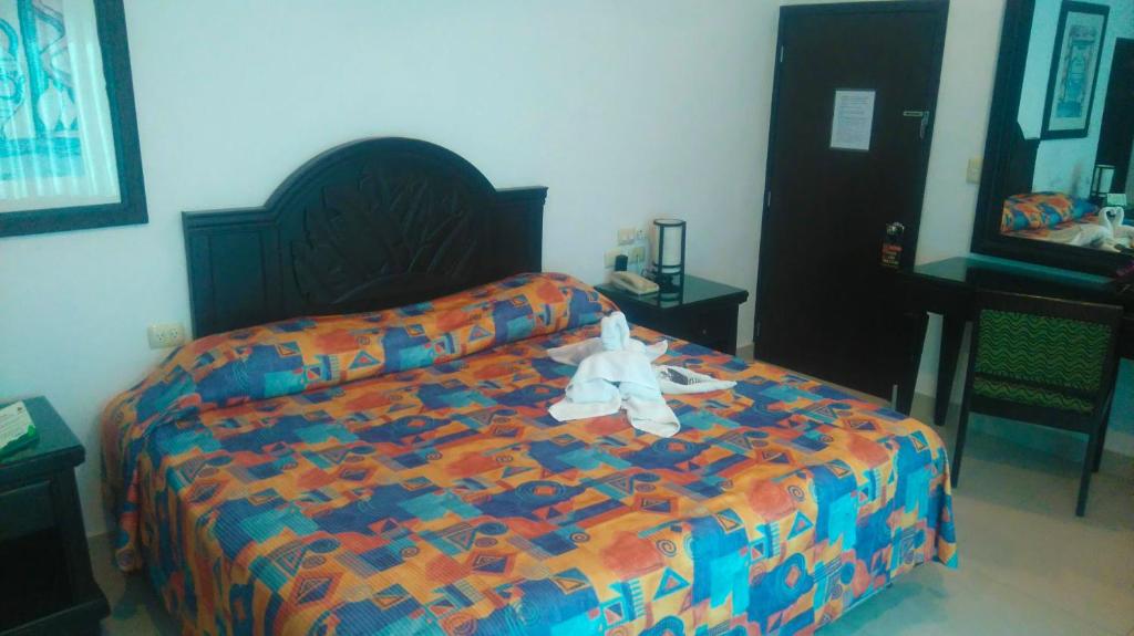 Postel nebo postele na pokoji v ubytování Hotel Del Sol