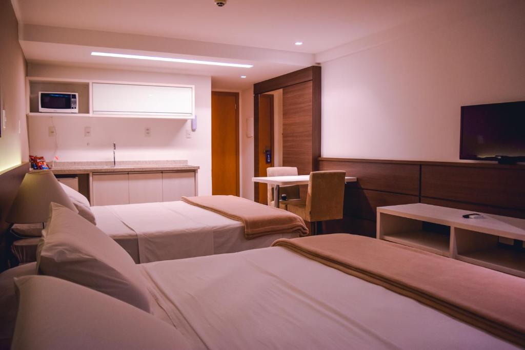 Postel nebo postele na pokoji v ubytování Atmosfera Hotel