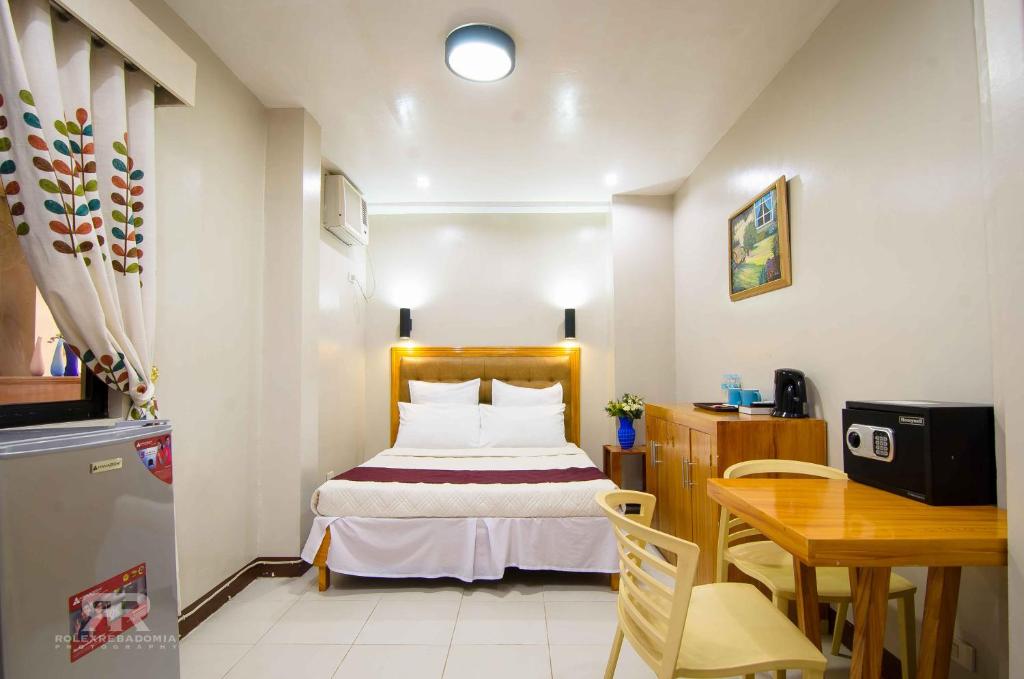 Postel nebo postele na pokoji v ubytování Diamond Hotel And Resto