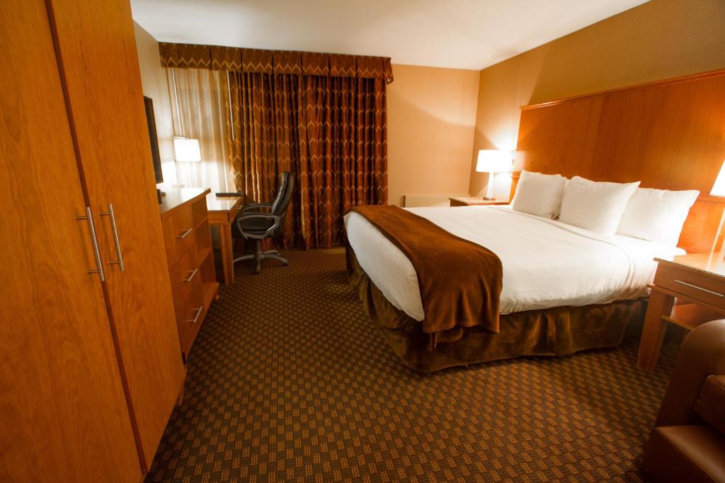 Postel nebo postele na pokoji v ubytování Mirabeau Park Hotel