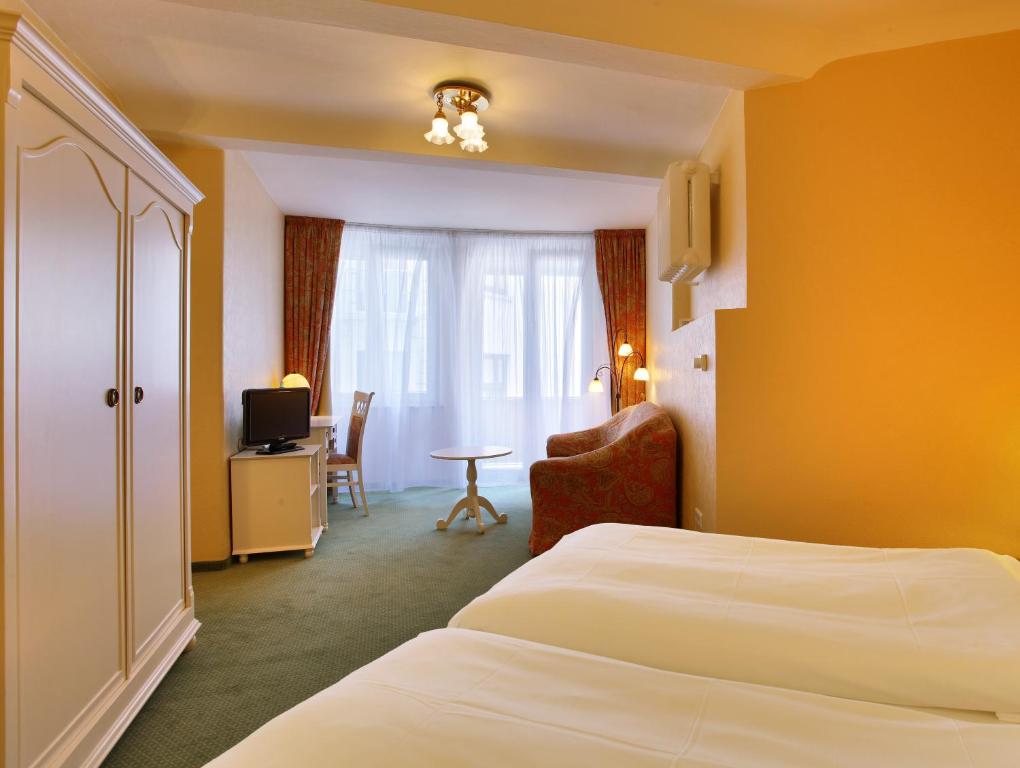 Postel nebo postele na pokoji v ubytování Hotel Bellmoor im Dammtorpalais