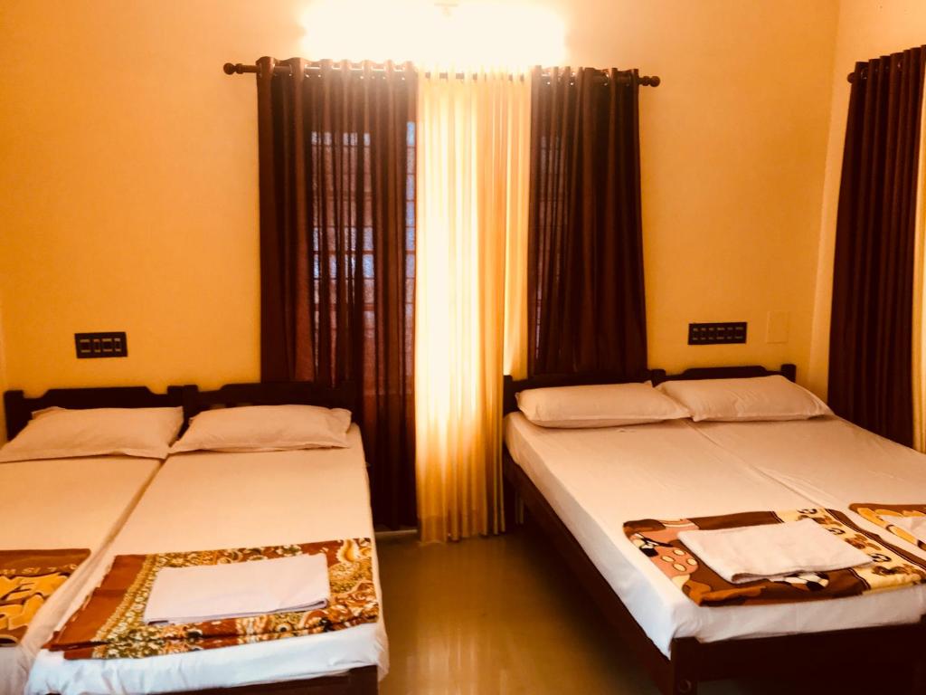 Postel nebo postele na pokoji v ubytování Bastian Homestay