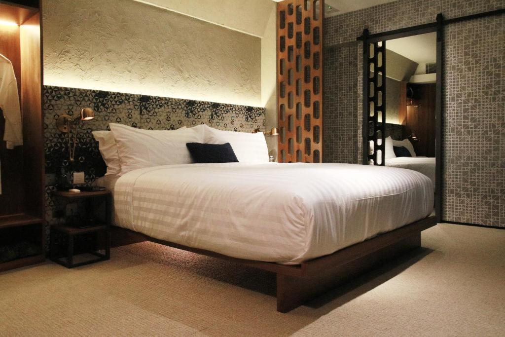 Katil atau katil-katil dalam bilik di Ovolo Central