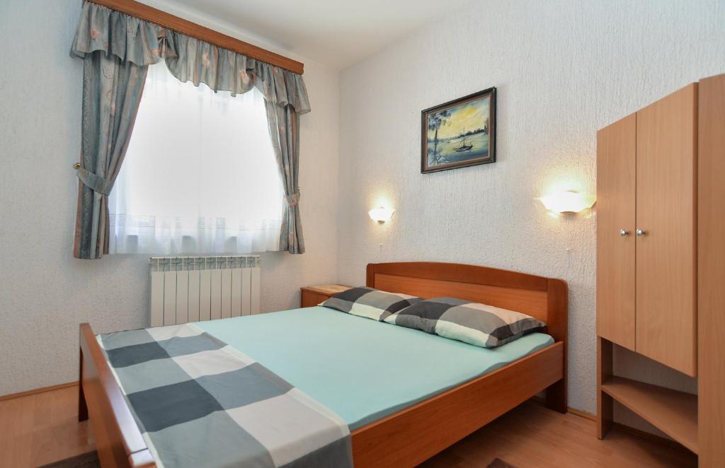 Łóżko lub łóżka w pokoju w obiekcie Apartments Vrcevan 811