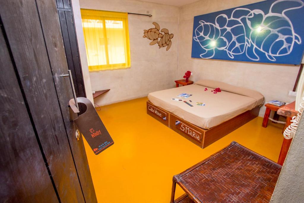 Postel nebo postele na pokoji v ubytování Surfactivity Guest House
