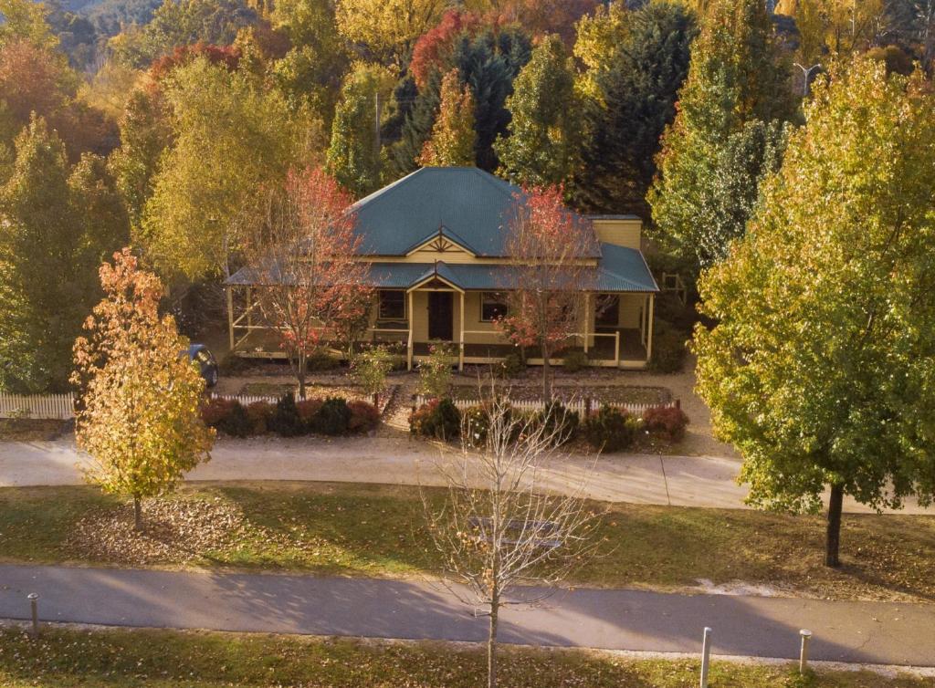 an aerial view of a house with trees at Autumn Beauty - Cottage 4 in Bright