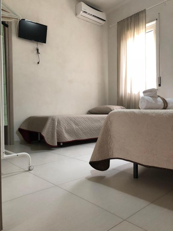Posteľ alebo postele v izbe v ubytovaní B&B La Via di Casa
