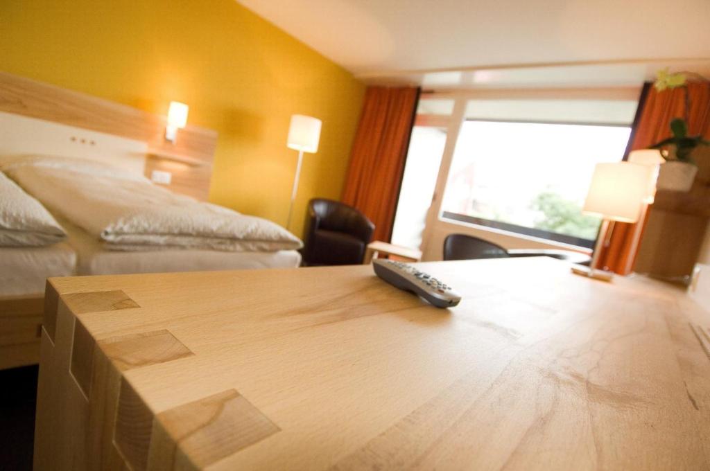 Postel nebo postele na pokoji v ubytování Hotel Gädi