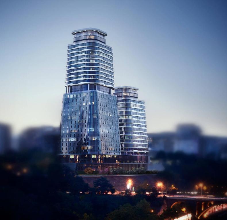 a tall building with many windows in a city at Apartment Tbilisi in King David in Tbilisi City