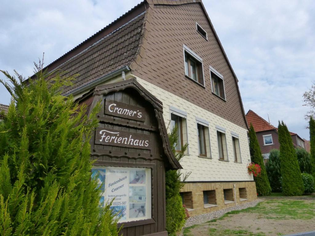 a building with a sign on the front of it at Ferienhaus Cramer in Walkenried