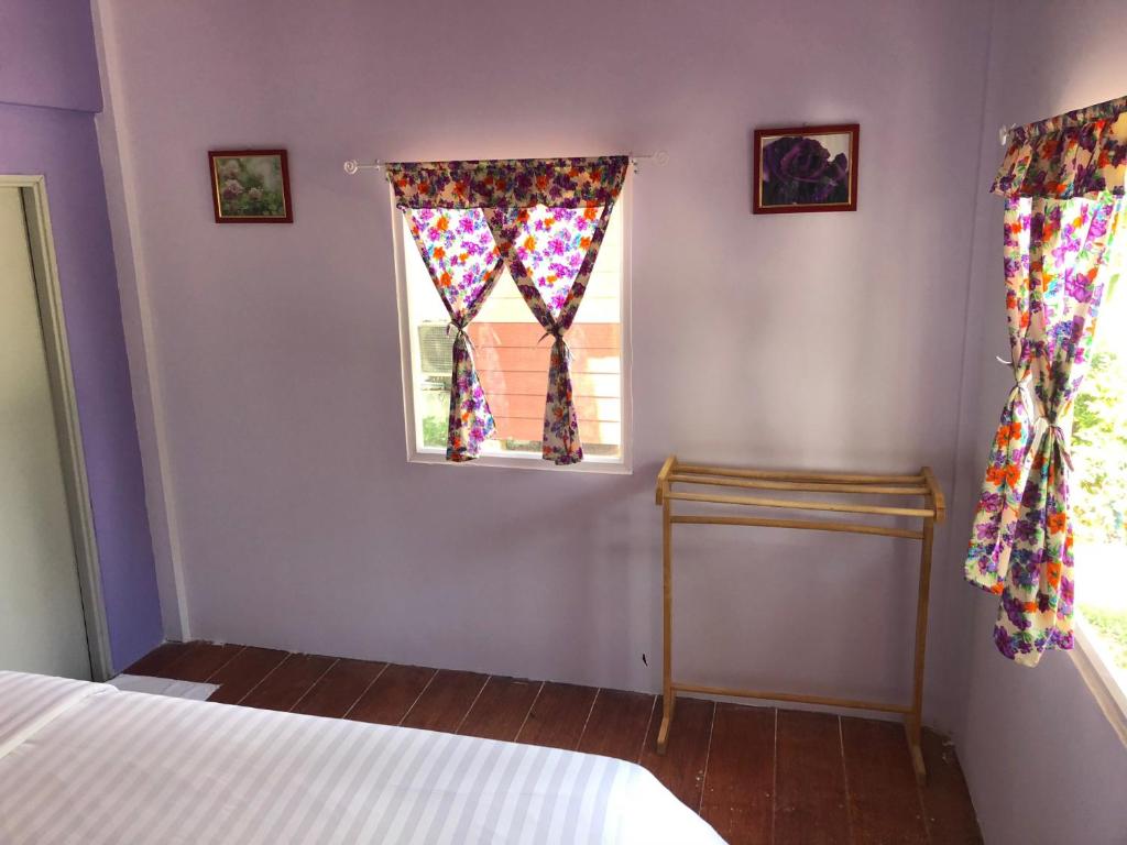 Postel nebo postele na pokoji v ubytování Sukhothai Indy Resort
