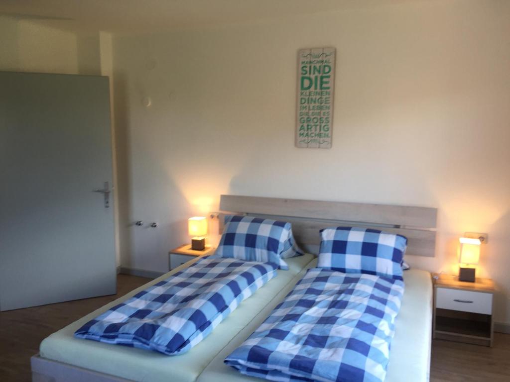 Postel nebo postele na pokoji v ubytování Parkweg Lodge