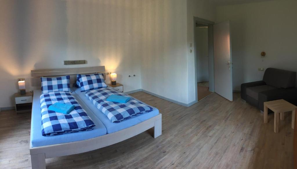 Postel nebo postele na pokoji v ubytování Parkweg Lodge