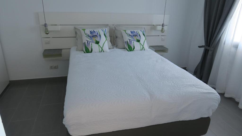 A bed or beds in a room at Luxury Apartment Playa del Ingles