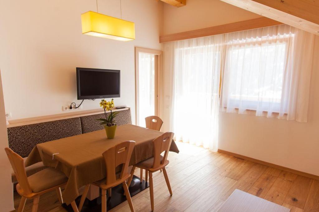 TV a/nebo společenská místnost v ubytování Residence Armonia