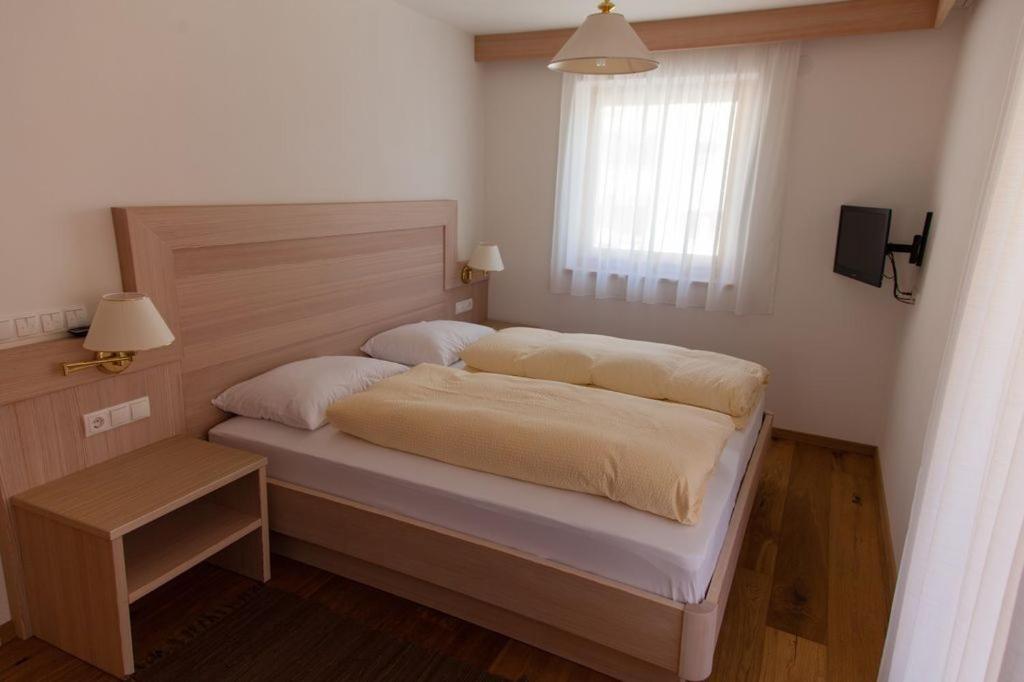Postel nebo postele na pokoji v ubytování Residence Armonia