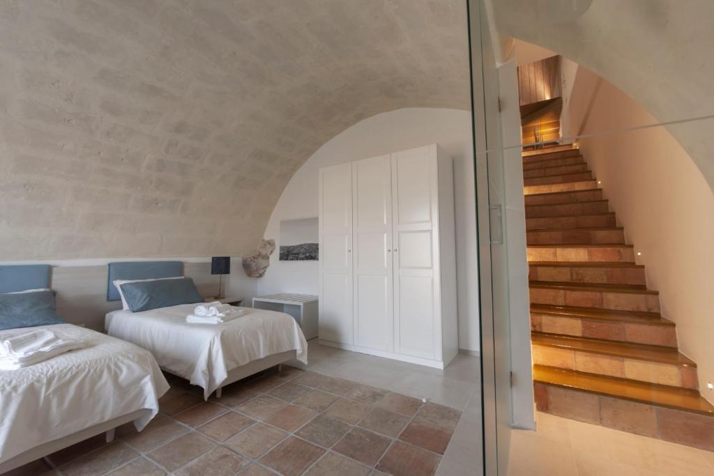 Postel nebo postele na pokoji v ubytování LAMIA MATERA 11