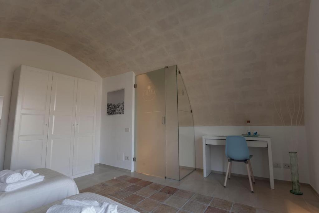 Postel nebo postele na pokoji v ubytování LAMIA MATERA 11