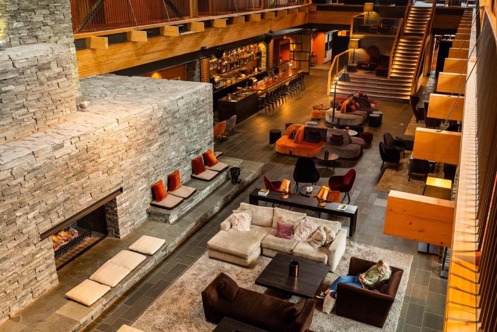 an overhead view of a living room with a fireplace at Copperhill Mountain Lodge in Åre