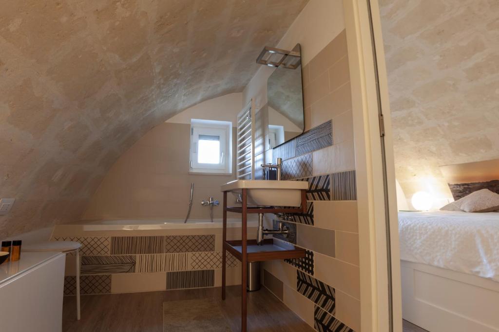 Postel nebo postele na pokoji v ubytování LAMIA MATERA 11