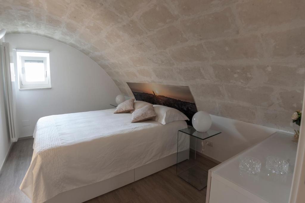 Postel nebo postele na pokoji v ubytování LAMIA MATERA 11