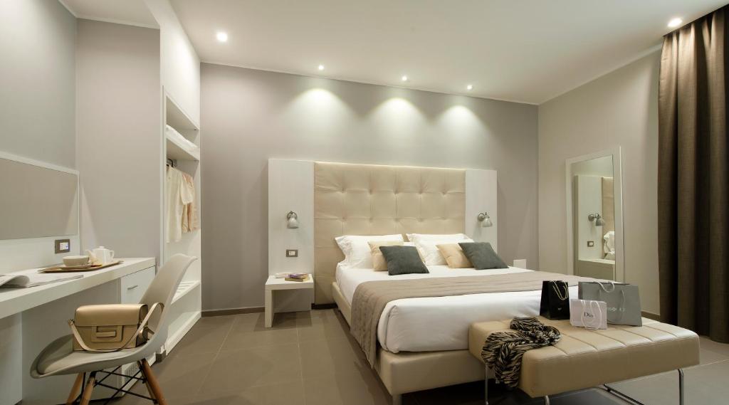 Postel nebo postele na pokoji v ubytování Hotel H21